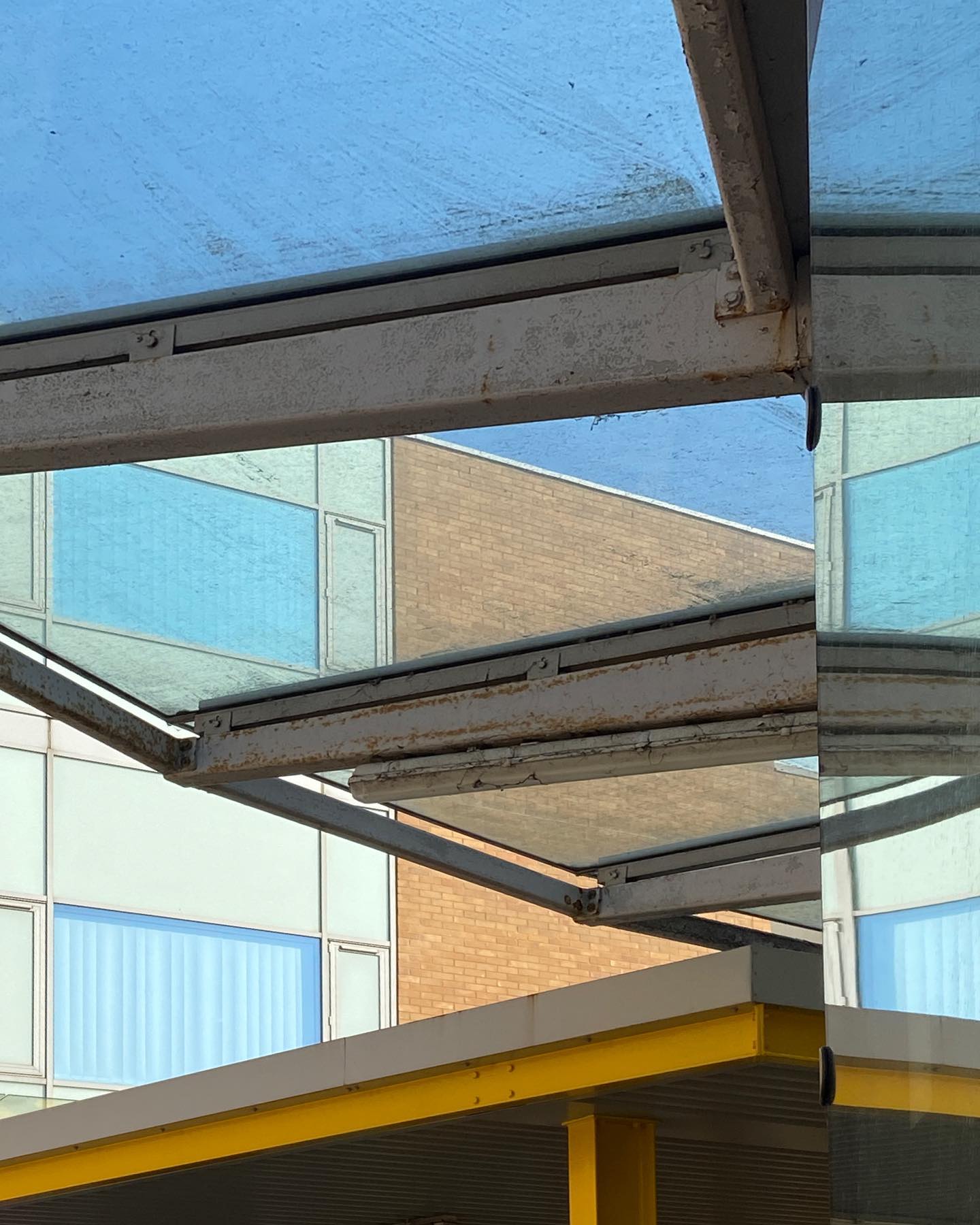 glass roof panels reflect clinical edges